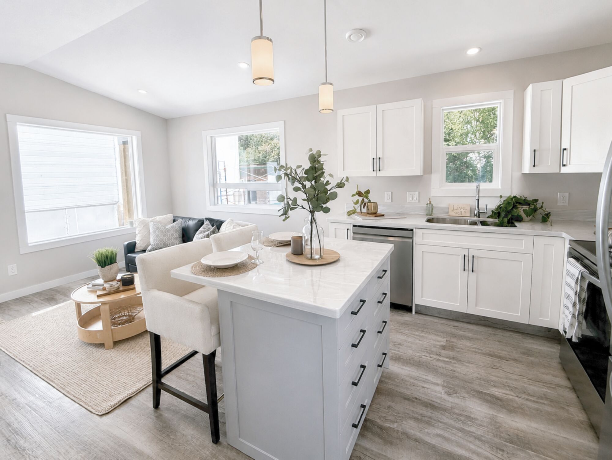 Bright open kitchen and living area inside a Kyllo park model home